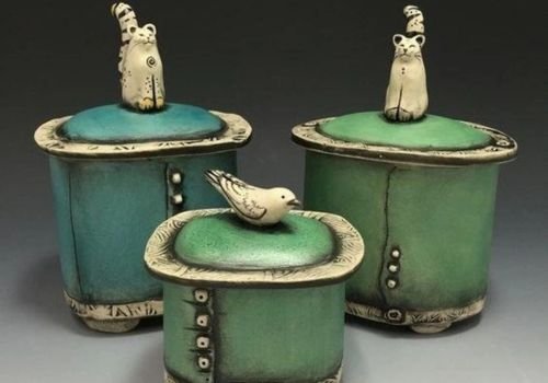 Handbuilt ceramic lidded keepsake jars with decorative textures and sculpted handles for the ceramic workshop at The Artist Outpost in San Diego